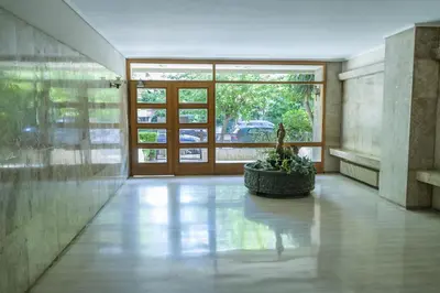 a hallway with a potted plant in the middle of a building at Blue Dreams - Spectacular Sea View Apartment in Athens in Athens