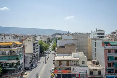an overhead view of a city street with buildings at Koukaki Spacious Penthouse with parking for Small Car in Athens