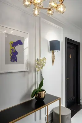 a living room with a table with a plant on it at Praxitelous Luxury Suites in Athens