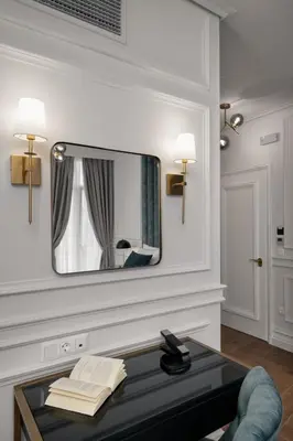 a living room with a mirror and a table at Praxitelous Luxury Suites in Athens