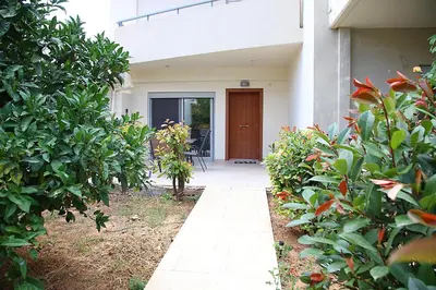 a walkway in front of a house with plants at 2 Bedroom Apartment near the Athens Airport, Spata in Spáta
