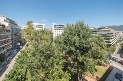 an overhead view of a city with trees and buildings at Central 3BR Apartment Next to Panormou Metro! in Athens