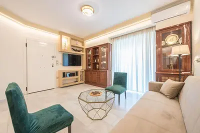 a living room with a couch and two chairs at Central 3BR Apartment Next to Panormou Metro! in Athens