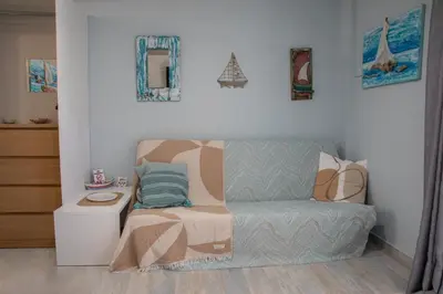 a room with a couch and a bed in it at Homeyfeel Stay Sea 2 - Island mood studio in Porto Rafti