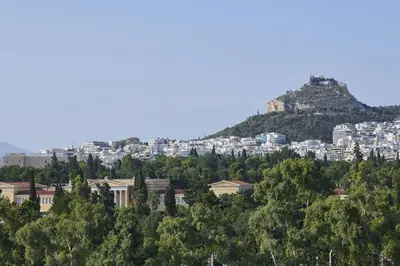 a view of the city of athens from above the trees at Ma Maison No6 Acropolis View Mansion,3bdrs,400Mbps in Athens