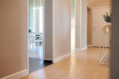 a hallway with a dining room with a table and a vase at Ma Maison No6 Acropolis View Mansion,3bdrs,400Mbps in Athens