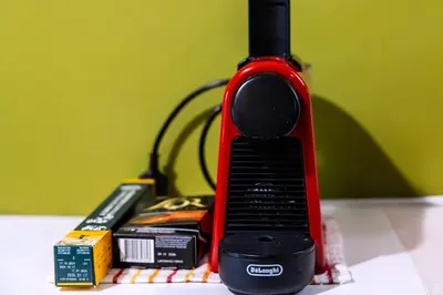 a red phone sitting on a table with books at Premium GaLeRia 4A in Athens