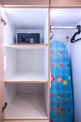 a closet with a microwave and a tie in it at Premium GaLeRia 4A in Athens