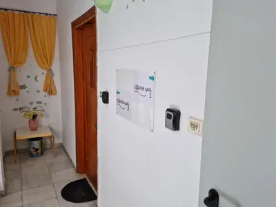 a room with a white refrigerator with boxes on it at STADION APTS Near Athens City Center in Athens