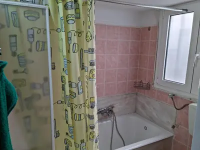 a bathroom with a tub and a shower curtain at STADION APTS Near Athens City Center in Athens