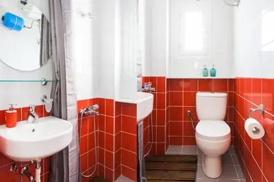 a bathroom with a toilet and a sink at Aegean style, city center studio next to Acropolis in Athens