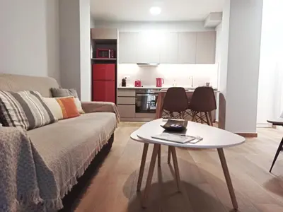 a living room with a couch and a table at Athens' Secret Jewel by YHA in Athens