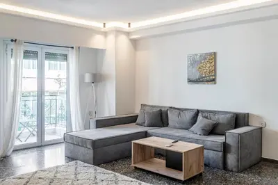 a living room with a couch and a coffee table at Lovely 2 bedroom rental in excellent location in Athens