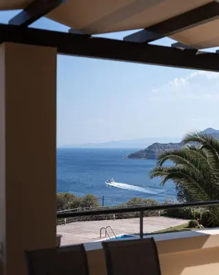 a view of the ocean from a balcony at Aphaia Villa & Residences Aegina in Agia Marina Aegina