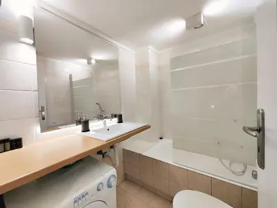 a bathroom with a sink and a toilet and a tub at Veno Donwtown in Athens