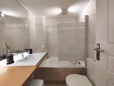 a bathroom with a tub and a sink and a toilet at Veno Donwtown in Athens