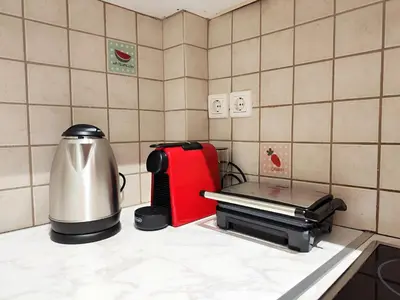 a kitchen counter with a coffee maker and a toaster at Veno Donwtown in Athens