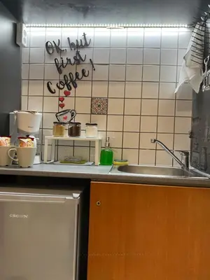 a kitchen with a sink and a tiled wall at Living near Acropolis by Sylvia Staikou at Nikis str in Athens