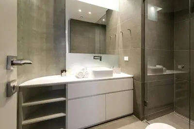 a bathroom with a sink and a shower at Kalypso, Urban Apartment with Unique Views of The Acropolis! in Athens
