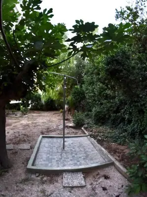 a metal trap in the middle of a field at Homeyfeel Stay Sea 1 - Modern studio next to the sea! in Porto Rafti