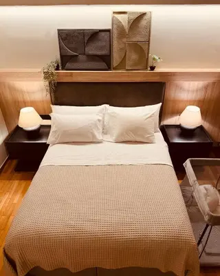 a bedroom with a large bed with two night stands at 2 BedRoom Apt - Live Like a Local in Kolonaki in Athens