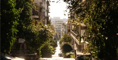 an alley way between buildings in a city at 2 BedRoom Apt - Live Like a Local in Kolonaki in Athens