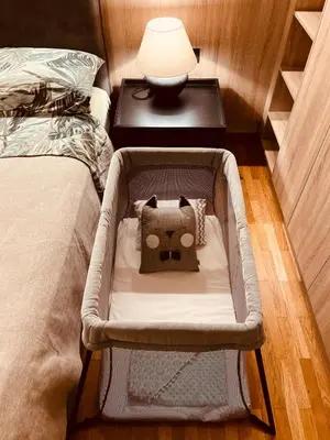 a suitcase with a pillow sitting on a bed at 2 BedRoom Apt - Live Like a Local in Kolonaki in Athens