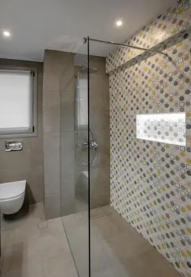 a bathroom with a glass shower with a toilet at Syntagma Apartments with Acropolis view in Athens