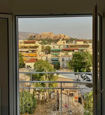 a view of a city from a window at Kalliopis Apartment in Athens