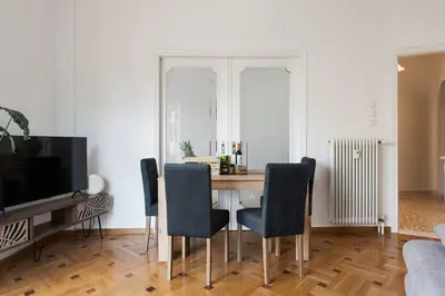 a dining room with a table and chairs at Diogenis' Jug in Athens