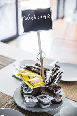 a plate of food with a welcome sign on it at P & I in Athens
