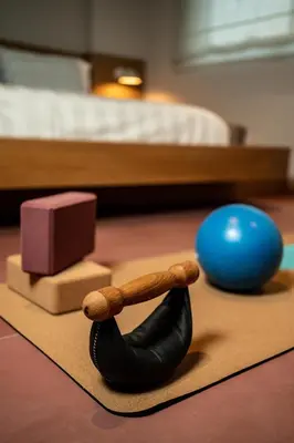 a toy gun and a ball on a rug with a bed at Alkima Athens Wellness Stay in Athens
