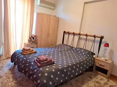 a bedroom with a bed with stars on it at Athens Christina's Acropolis Apartment in Athens