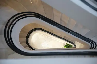 a round window in a building with a staircase at The Vault Athens in Athens