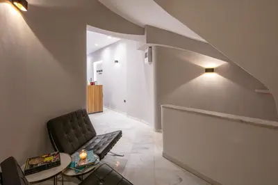 a living room with a couch and a table at The Vault Athens in Athens