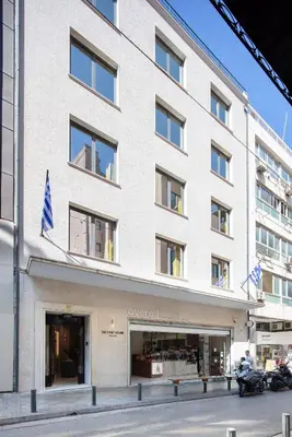 a large white building with a store front at The Vault Athens in Athens