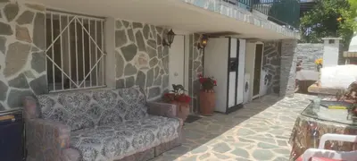 a couch sitting on the patio of a house at SHLEY House 1 in Artemida