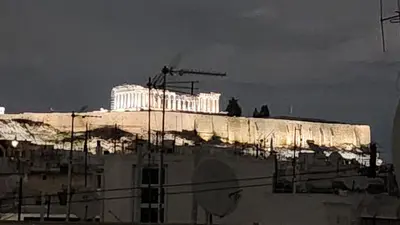 a building on top of a hill with a building at Cozy Studio in Koukaki Athens BY ZAIN in Athens