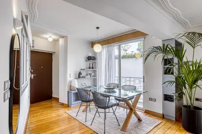 a dining room with a glass table and chairs at Monastiraki Stylish Loft W/ Acropolis View/Bathtub in Athens
