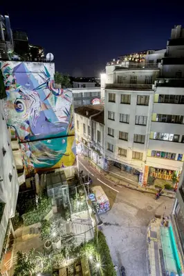 an aerial view of a city at night with buildings at Monastiraki Stylish Loft W/ Acropolis View/Bathtub in Athens