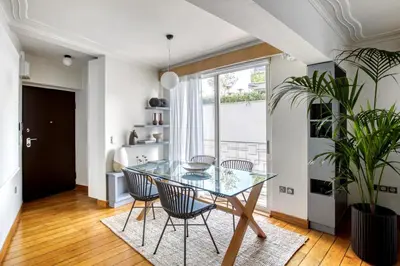 a dining room with a glass table and chairs at Monastiraki Stylish Loft W/ Acropolis View/Bathtub in Athens