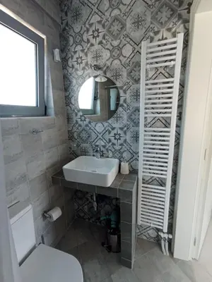 a bathroom with a sink and a mirror at Andi's Studio Porto Rafti in Porto Rafti
