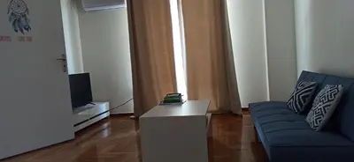 a living room with a couch and a tv at 2 Bed Flat - Sleeps 5 - Parking - Wifi in Athens