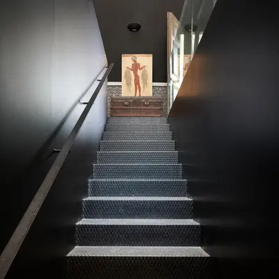 a staircase leading up to a building with a painting at Varaba Country House in Markopoulo