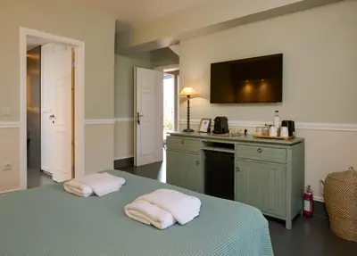a kitchen with two towels on top of a bed at Varaba Country House in Markopoulo