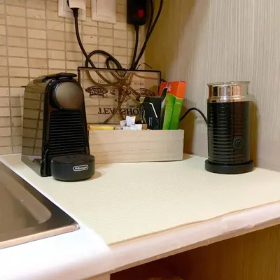 a counter top with a coffee maker on it at A7 Beauty Vouliagmeni Apt in a unique Spot in Athens