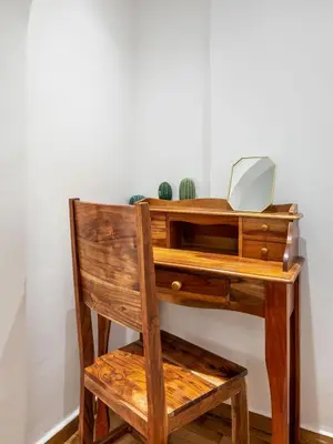 a wooden desk with a laptop on top of it at Luxury Museum Apartment Athena in Athens