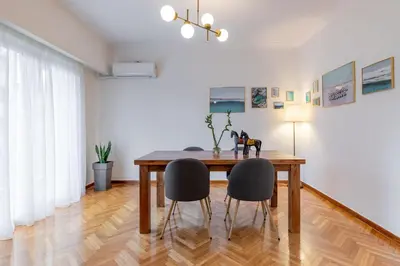 a dining room with a table and two chairs at Luxury Museum Apartment Athena in Athens