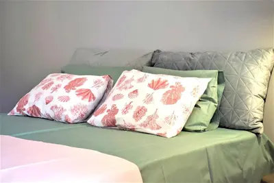 two pillows sitting on top of a couch at Bright & Cozy 1BR in Athens city center in Athens