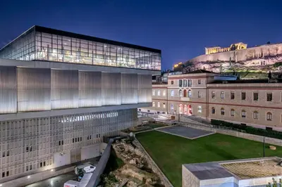 an external view of a building with a lawn in front at Modern flat in the grounds of Acropolis Monuments -Armonia- in Athens